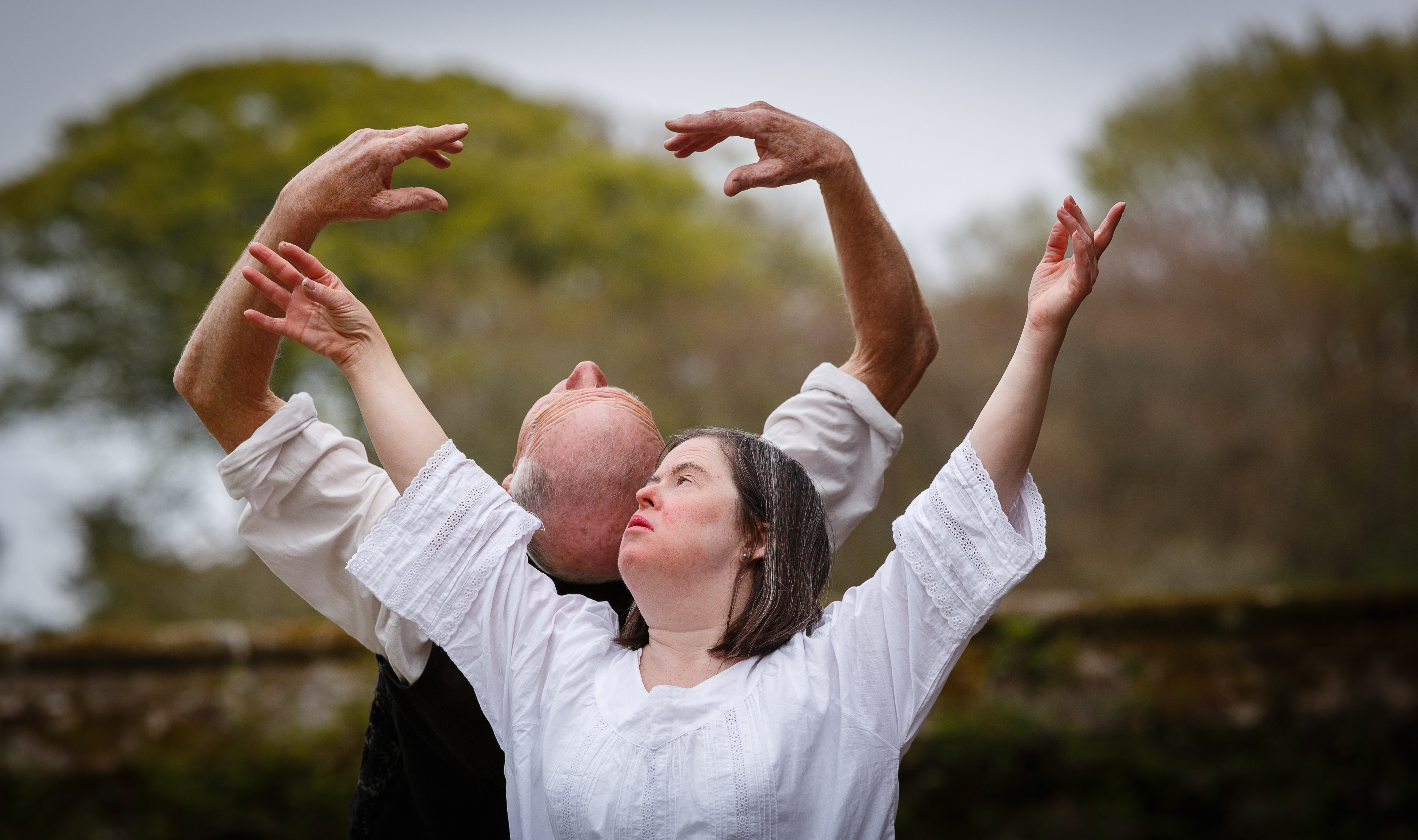 2 people dancing back to back