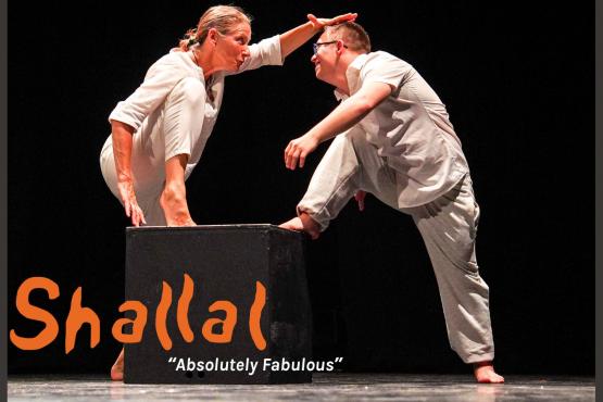 woman and young man in white with one foot on a black box with black background