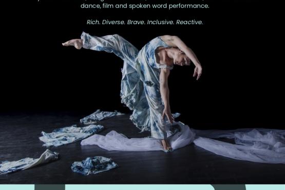 dancer in blue and white on black background