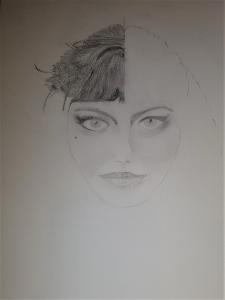 Pencil drawing of a woman's face with eye makeup. The right-hand half of the hair is drawn in detail and the left half left blank.