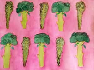 Picture of broccoli stems repeated on a pink background