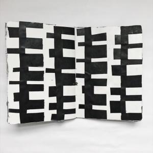 black and white collage pattern in a sketchbook