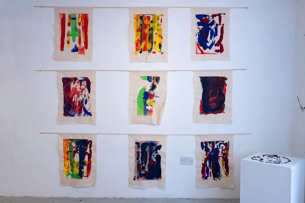 screen prints hanging on the wall