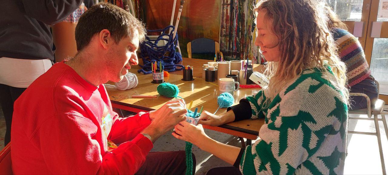 2 people french knitting together